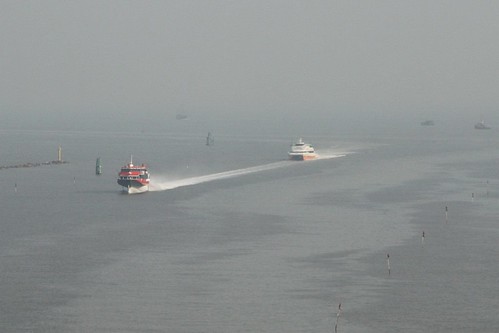 TurboJet hydrofoil overtakes a New World First Ferry catamaran