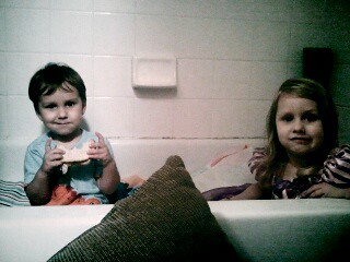 Cara and Ollie in the bathtub because of the tornadoes.