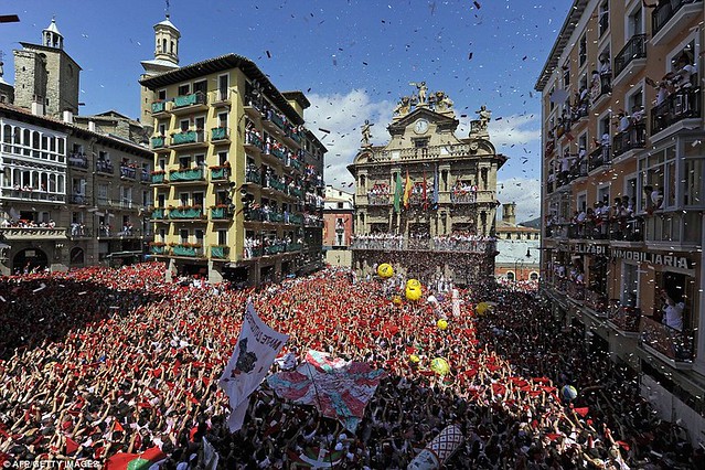Sun, sangria and a sea of red... as Pamplona prepares for another gorefest at the running of the bulls  1