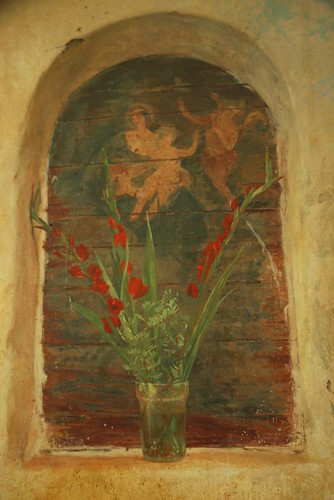 Mary with baby Jesus and angel, red flowers in a jar, niche painting, Healdsburg, California, USA by Wonderlane