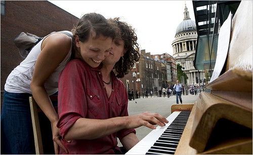 Trying out one of the 30 pianos placed around London, this one at the Millennium Bridge.