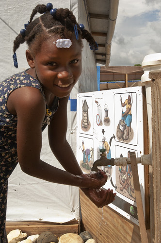 Angeline washes her hands to protect against cholera