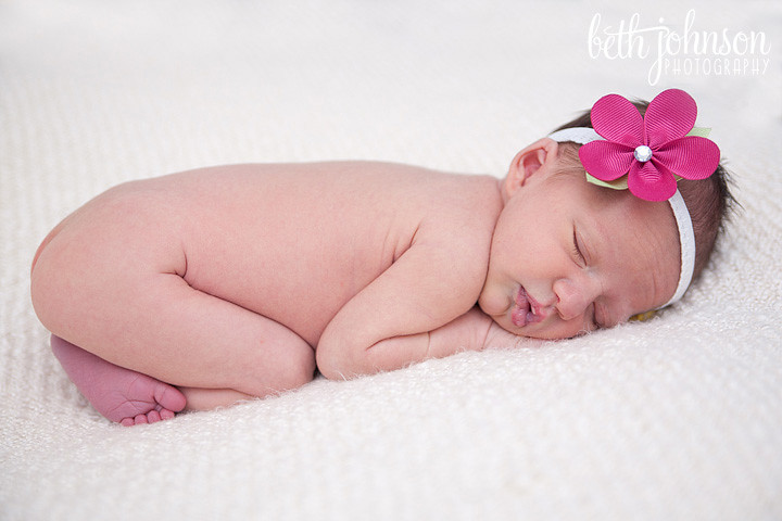 newborn baby girl with pink headband