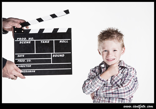 Child with movie clapper board