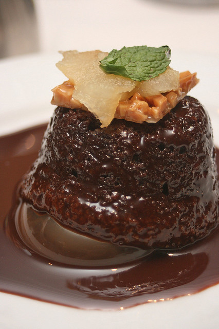 Warm Chocolate Cake (vegetarian) with milk chocolate sauce and sweet roasted pears