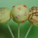 Vanilla cake pops covered in white chocolate with various decorations