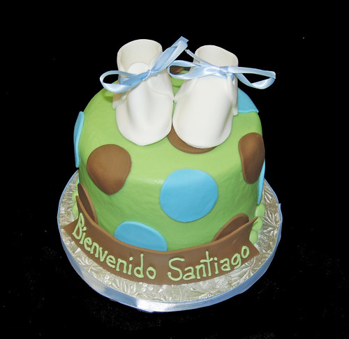 green blue and brown polka dot topper baby shower cake with baby shoes