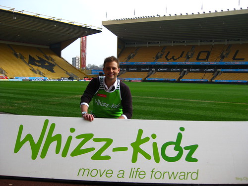 Sam poses against the backdrop of his beloved Wolves FC stadium