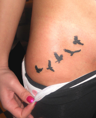 bird silhouette tattoo. Bird silhouette on stomach