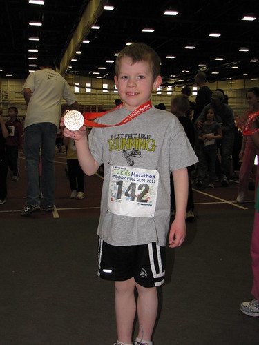 Benjamin and his TC Kids Marathon medal