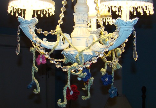 Chandelier with garland of crochet flowers