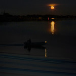 Supermoon helps boatman navigating through the darkness