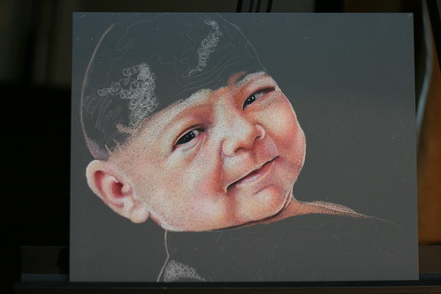 In progress colored pencil portrait of an infant entitled Alexandra.
