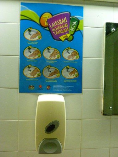 4b. Wash hands with soap poster but dispenser is soapless.