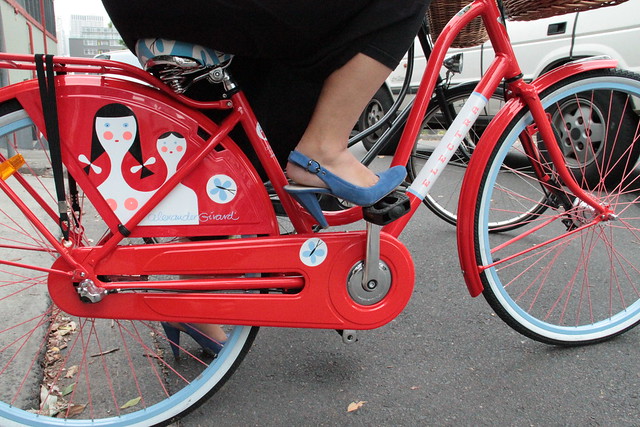 blue shoes, red bike