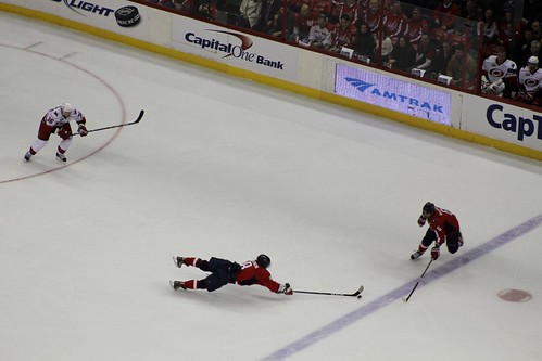 Alex Ovechkin extends to keep the puck in the zone on the power play.