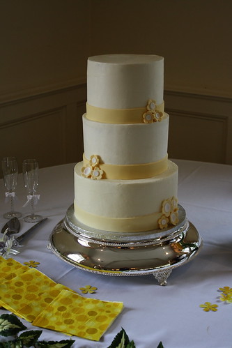 white and yellow wedding cakes