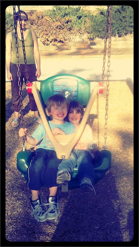 Judah and Grace on the swing