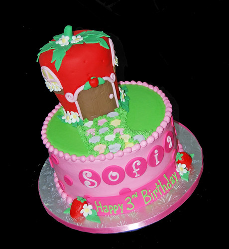 pink red and bright green polka dot 3rd birthday cake with a strawberry house for a Strawberry Shortcake Celebration