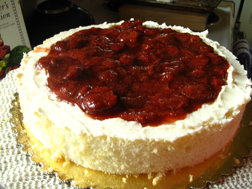 white velvet cake with homemade strawberry conserves and crispy white frosting