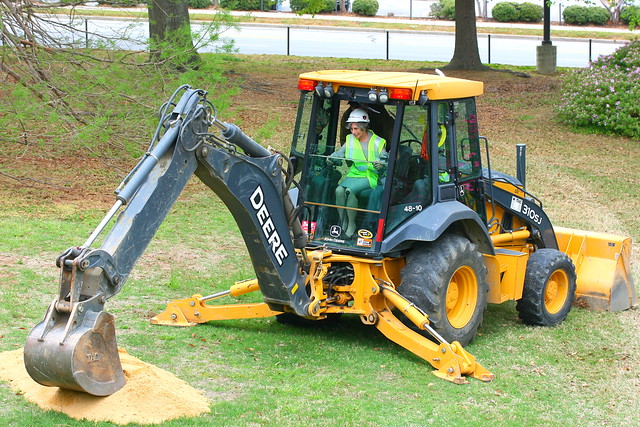 Library Dean uses a Backhoe