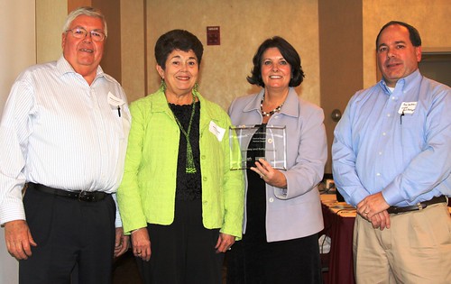 Rodney and Betty Hestekin receive a Partners in Affordable Housing Award from USDA  Rural Development Minnesota State Director Colleen Landkamer and acting Multi-Family Housing program director Rod Jackson.