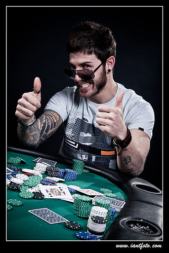 Win of stylish tattooed man in the casino.