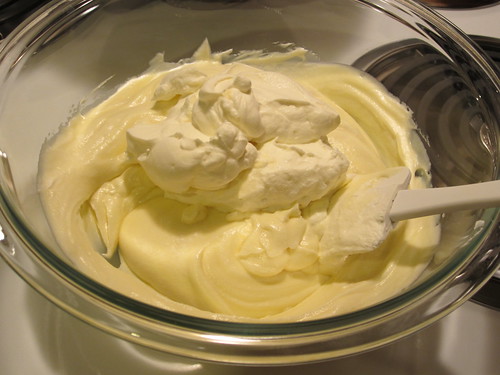 adding whipped cream to white chocolate