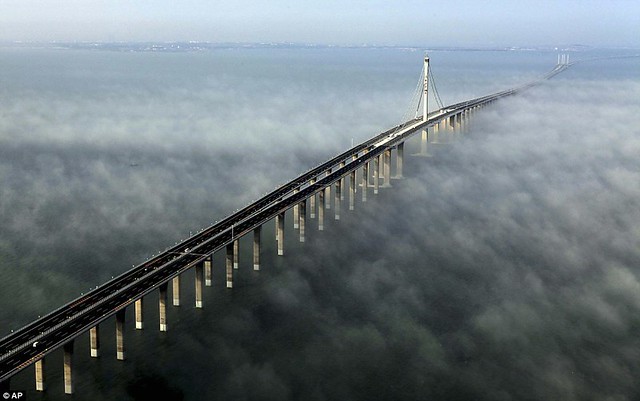 That is a £1bn bridge too far World's longest sea bridge opens to traffic in China... but it will only hold the title for five years  1
