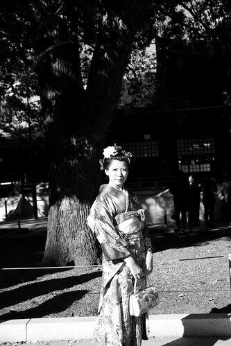 Girl in kimono under a tree
