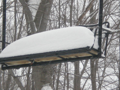 Snow piling up on chairlift at Boyne