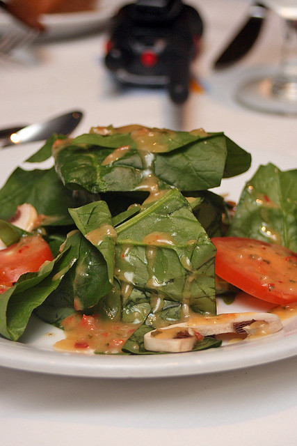 Spinach salad with plum tomatoes, sliced mushrooms and toasted sunflower seeds