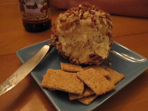 Farmhouse cheddar cheese ball with rosemary, bourbon, and pecans
