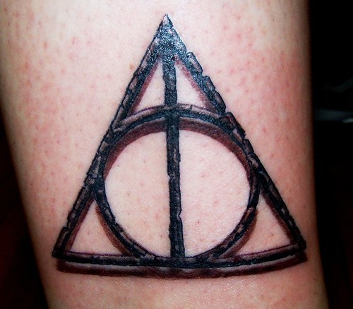 Realistic Deathly Hallows Symbol Tattoo done in Bronze washes 
