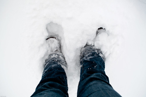 view of my legs from above with me standing in the snow, snow is covering my feet up to my ankles