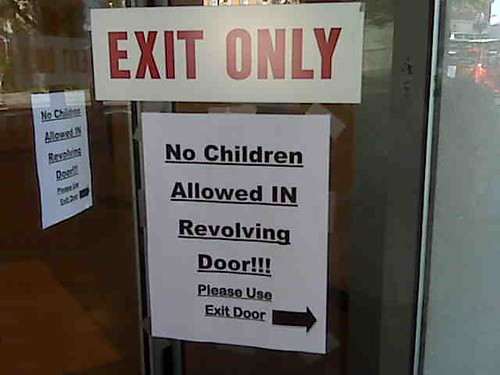 Sign on revolving door