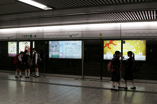 Waiting for the train after school at Shek Kip Mei