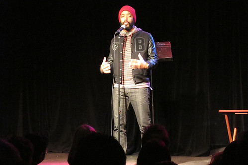 Wyatt Cenac telling a story about spreading Christmas cheer in a prison in Texas