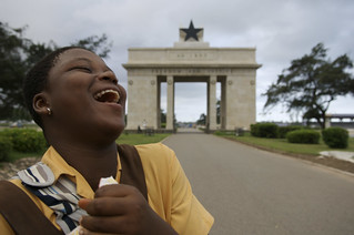 Young girl laughing in street Ghana