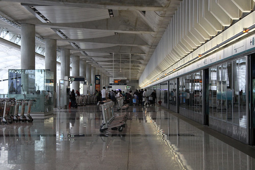 Luggage trolleys lined up beside the Airport Express arrival platform for Terminal 1
