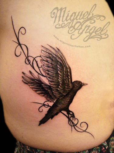 Custom raven and patternt tattoo