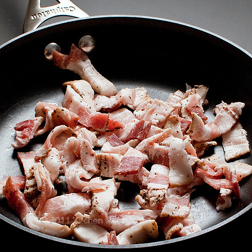 diced raw bacon in saute pan