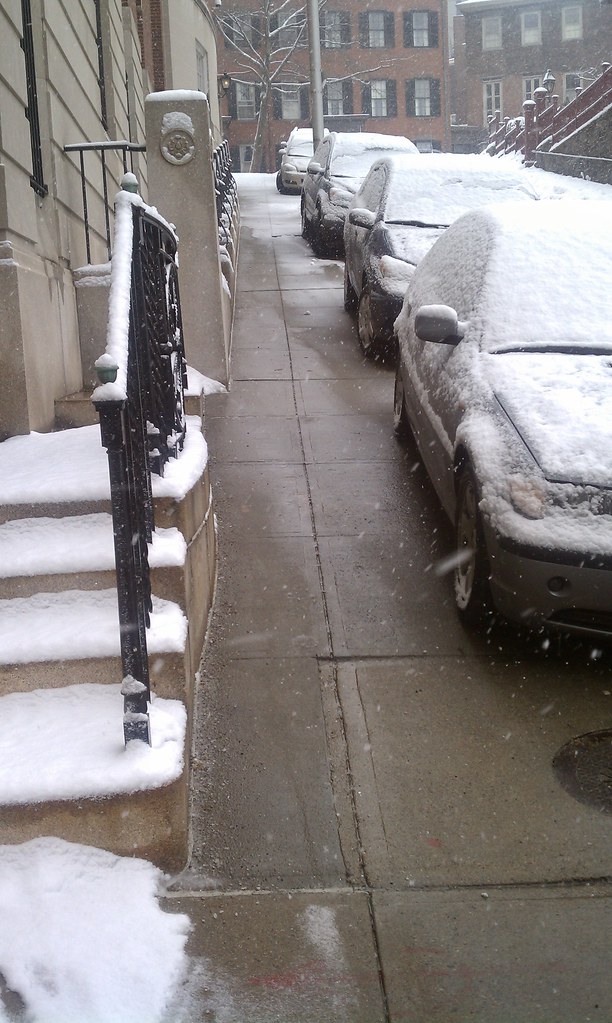 Clearest sidewalk in Providence, yet has parked cars on it??