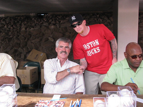 Tom donated to charity to get his photo taken with Bill Buckner while wearing his 'Boston Sucks' shirt
