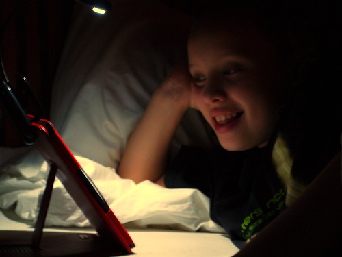 Day #231 reading Kindle with night light by edtechie99, on Flickr