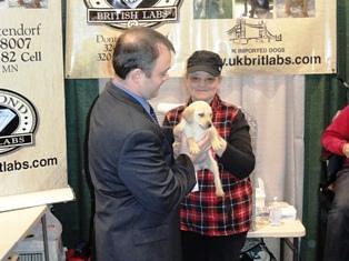 FSA Administrator Jonathan Coppess visits with a Labrador retriever breeder at Pheasant Fest. Labs are recognized as excellent upland game bird and waterfowl retrievers.