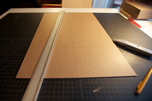 lots of cardboard cutting Every book started as a sheet of board precisely 
