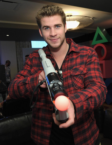 Actor Liam Hemsworth checks out the latest PS3 games while kicking back at the PlayStation NBA All-Star Players Lounge on February 18, 2011 in Los Angeles, California.