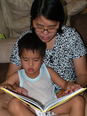 Julian reading with Mummy