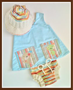 *REDUCED* Puppy Love Reversible Pinafore with soaker and sun hat, 12-18 months